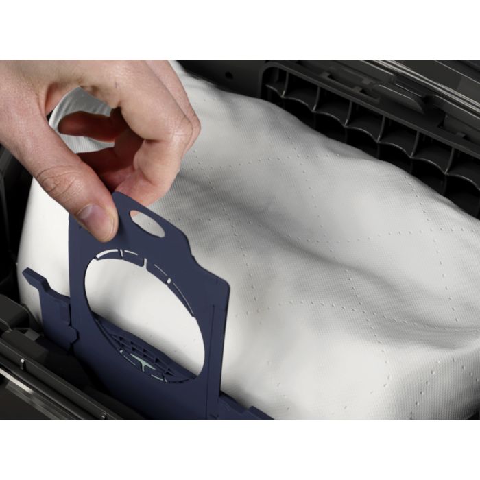 Showing the easy bag exchange. hand changing the s-bag in vacuum cleaner.