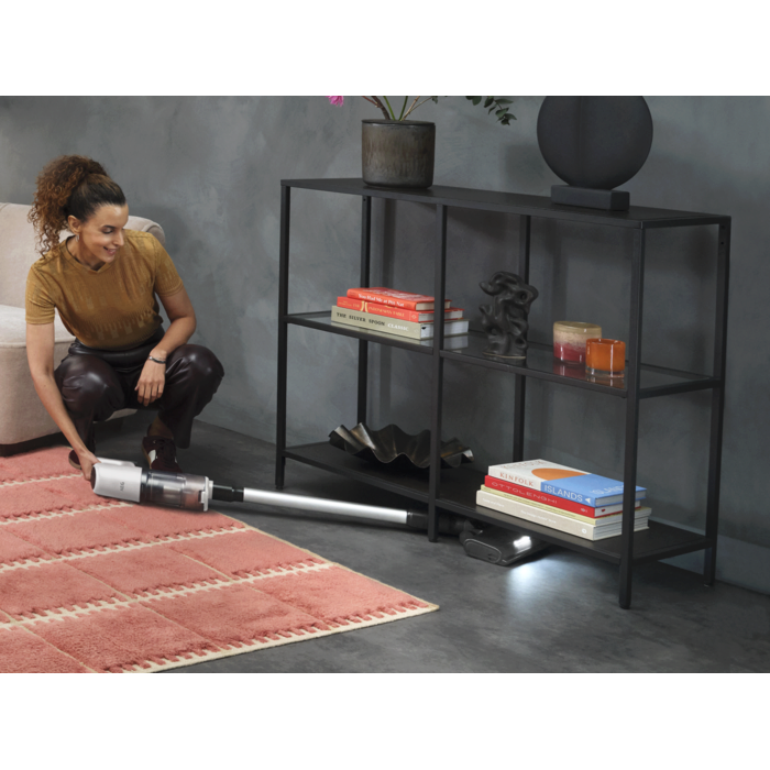 Cordless cleaner designed for easy cleaning under furniture.