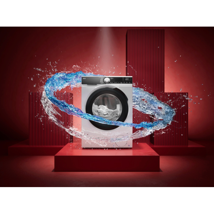 Frontlader‑Waschmaschine mit Wasserwelle vor rotem Hintergrund, Symbol für starke Reinigungskraft.