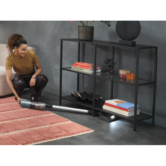 Cordless cleaner designed for easy cleaning under furniture.