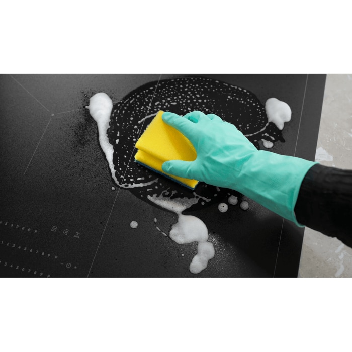 Hob Cleaner being applied with foam and sponge, highlighting its easy-to-clean feature.