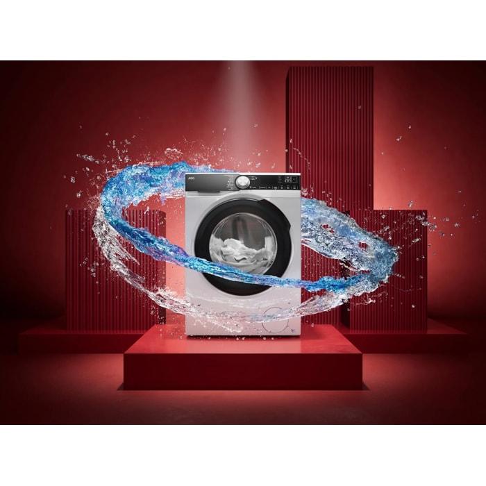 Frontlader‑Waschmaschine mit Wasserwelle vor rotem Hintergrund, Symbol für starke Reinigungskraft.