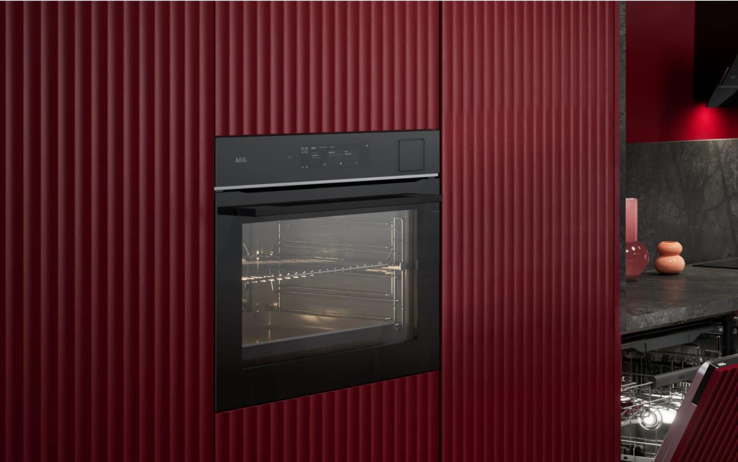 View of an oven surrounded by red paneling.